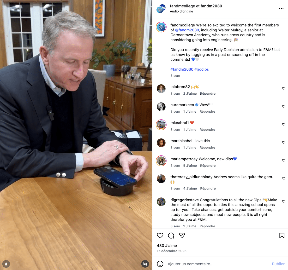 College official making an admissions call on speakerphone at a wooden desk, welcoming new students to F&M
